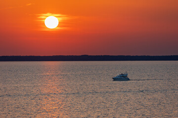 cruise yacht on the background of the sea sunset