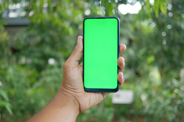 rear view of young man using smart phone at outdoor 