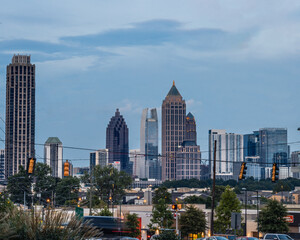 Downtown/Midtown City of Atlanta Skyline showing several prominent buildings and hotels under the sky during blue hour.