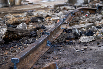 Close-up of industrial waste garbage in an abandoned factory workshop