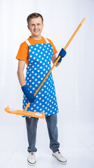 a man in a blue apron, rubber gloves, an orange t-shirt, jeans and white sneakers with a mop. isolated white background