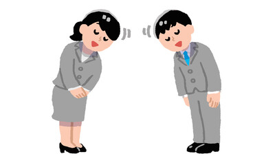 挨拶するスーツ姿の男性女性