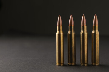 Bullets on black background, closeup. Space for text