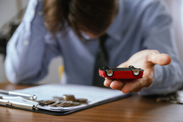 Stressed man is worried about car loan, problems paying for car repairs, car installments, car...