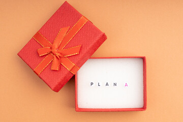 in an open gift box the inscription plan A