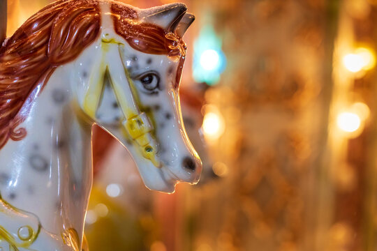 a horse on a carousel close-up of the head, the background is blurred
