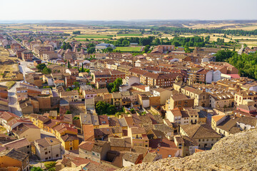 Panoramic view of the medieval village of San Esteban de Gormaz at dawn on a summer day.