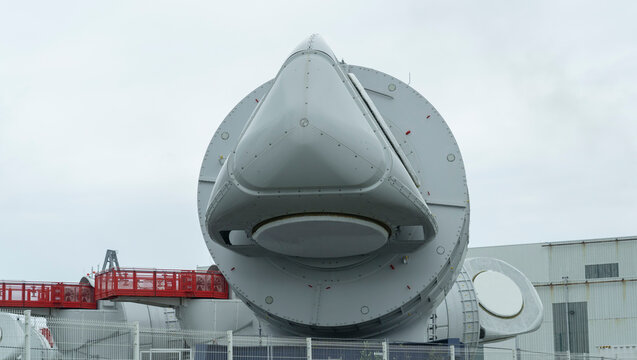 Saint Nazaire, France. View Of The Generator Assembled On The Upper Part Of The Wind Turbine. Big Metal Part Ready To Use To Building A Wind Turbine. Green Energy. GE Factory