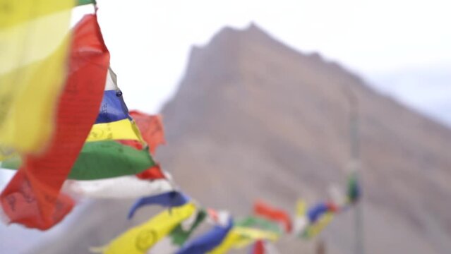 Buddhist prayer flags (lungta) in Spiti Valley and Ladakh. Flying prayer flags of Om Mani Padme Hum.