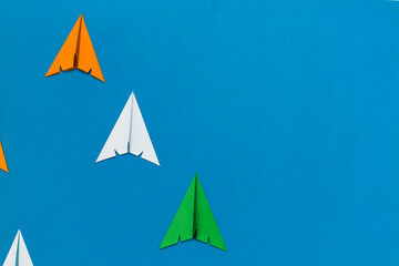 Indian tricolor paper rocket crafts isolated on blue background. Space for text. 