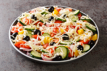 Shopska salata vegetables Chopped Salad with cheese closeup in the plate on the table. Horizontal