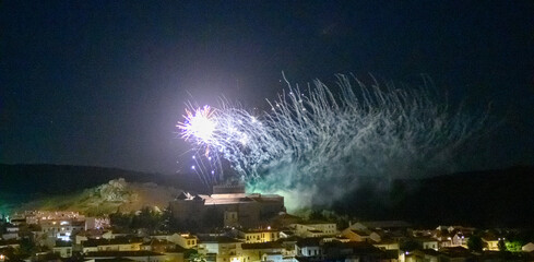 fireworks over village castle at night