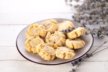 sugar and gluten free keto cookies on white wooden background decorated with lavender