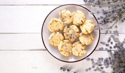 keto cookies on white wooden background decorated with lavender, top view, place for text