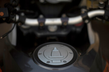 Gas tank of motorcycle. Details of bike. Cover on gas tank.