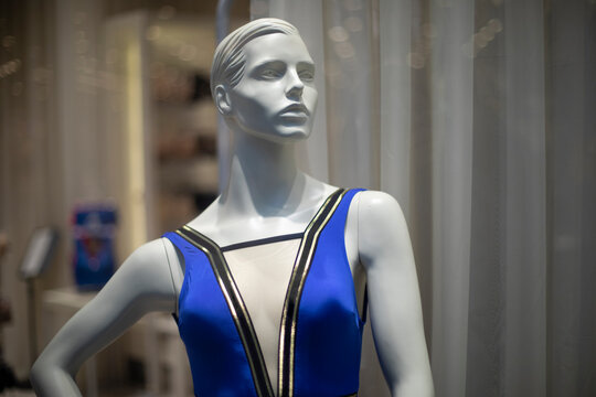 Women's mannequin in clothing store. Plastic figure of woman. Store details. Demonstration of clothes.
