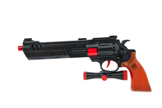 Toy gun black pistol for fun isolated on the white background