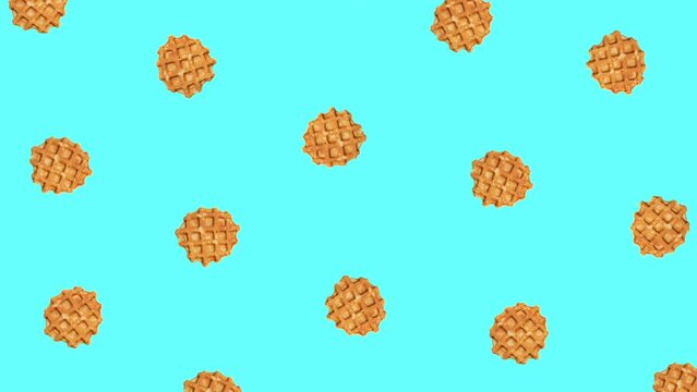 Fashion food animation of zoom in and zoom out ,spinning waffles on a blue background.