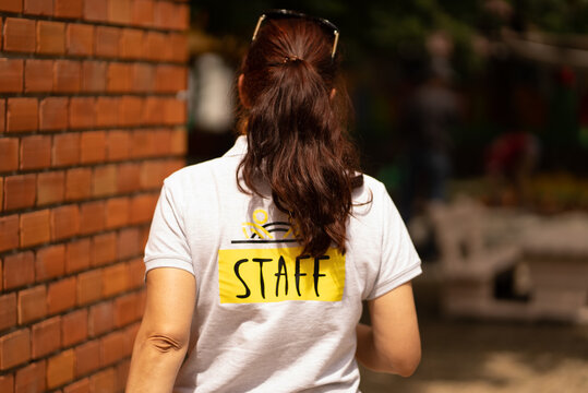 Staff member going to do some work outside