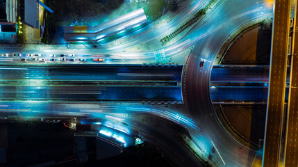 Expressway top view, Road traffic an important infrastructure,car traffic transportation above intersection road in city night, aerial view cityscape of advanced innovation, financial technology	