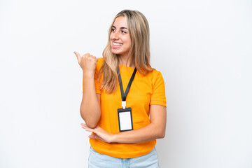 Young caucasian woman with ID card isolated on white background pointing to the side to present a product