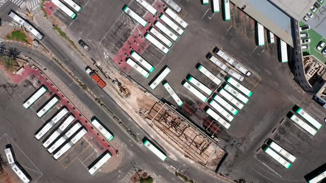 Bus terminal during work hours, Top down aerial view.