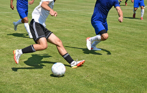 Fototapeta Soccer players in action outdoor match