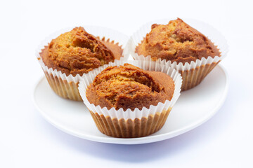 Sweet Banana muffins in white plate isolated on white background.