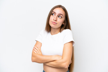 Young caucasian woman isolated on white background making doubts gesture while lifting the shoulders