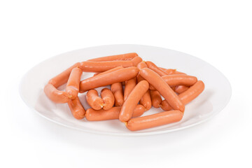 Bunch of small sausages on dish on a white background