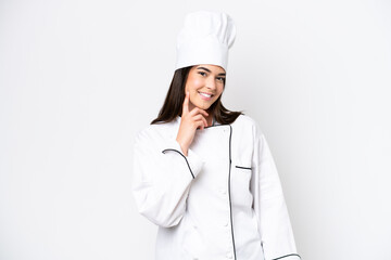 Young Brazilian chef woman isolated on white background thinking an idea while looking up