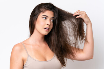 Fototapeta premium Young Brazilian woman isolated on white background with tangled hair. Close up portrait