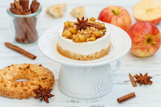 Apple vanilla mini cheesecake. Homemade cake made from shortbread cookies, mascarpone or cream cheese, caramelized apples with cinnamon and star anise. A healthy dessert. Breakfast. Selective focus