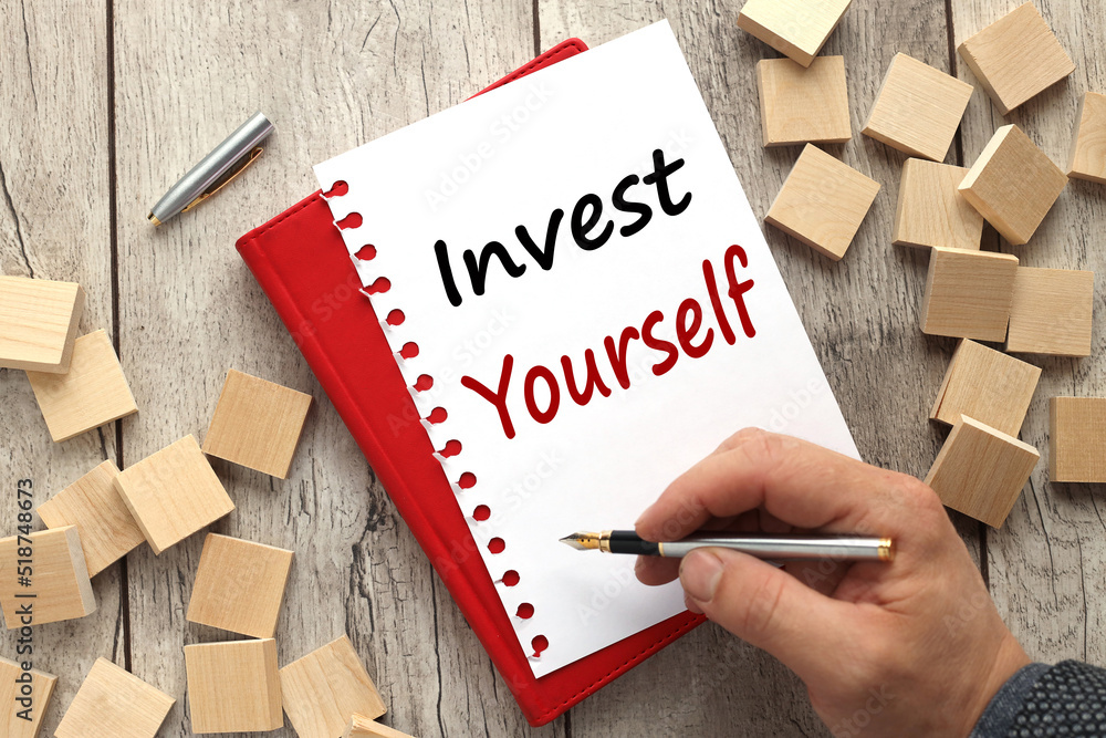 Poster invest in yourself abstract word man writing text on notepad