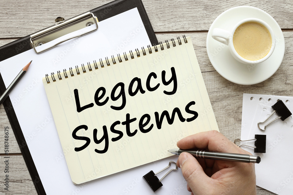 Poster word writing text showing legacy systems. soa application update business concept written on a notep