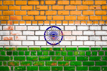 National  flag of the India on a grunge brick background.