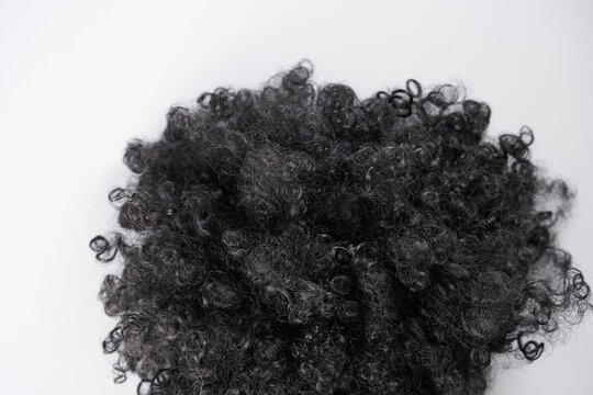 Curly wig isolated on a white background