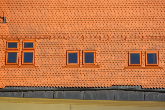 Roof of an historic house in center of Telc city with an roof windows.