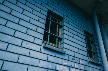 blue brick wall with a window