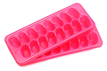 Plastic pink mold for ice. Refrigeration of drinks.
