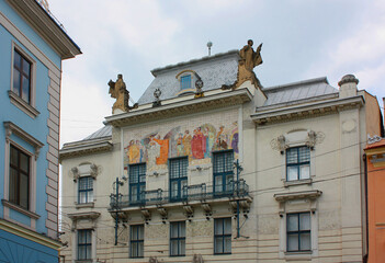 Fototapeta na wymiar Panel with 12 Olimpic gods on the facade of Museum of Fine Arts in Chernivtsi, Ukraine