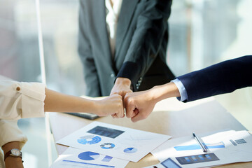 Close up view of business people putting their hands together. Collaboration business team success...