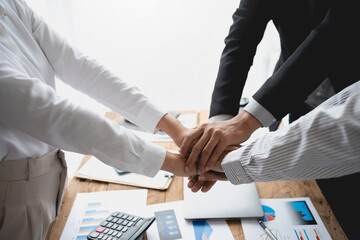 Close up view of business people putting their hands together. Collaboration business team success concept.