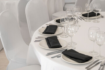 Concept of renting banquet hall served for celebration. Tables covered with white tablecloths,...