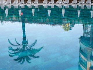 reflections in a hotel pool