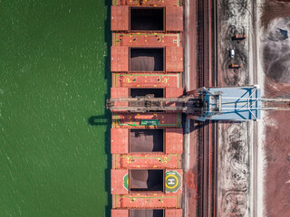Cranes Unloading Cargo from a Bulk Carrier Ship at Port