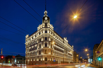 Naklejka premium Night cityscape of Riga. Lights on long exposure. Illuminated building