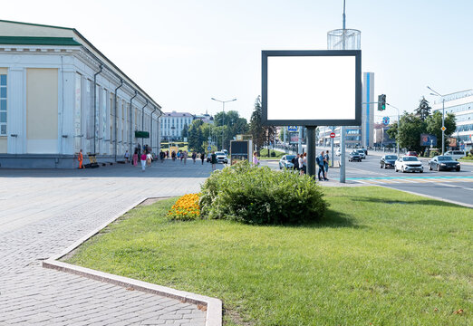 Large Billboard Mockup Along City Highway. Brand, Product, Service, Business Ad In High Traffic Area. Hoarding. Out Of Home Advertising. Summer Downtown With Pedestrians And Drivers. Photo