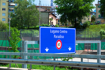 Lugano, Switzerland - June 4, 2022: Traffic sing on the main road leading to Lugano Center and Paradiso, Switzerland