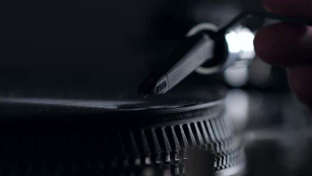 DJ headshell on spinning record on turntable. Listening the music